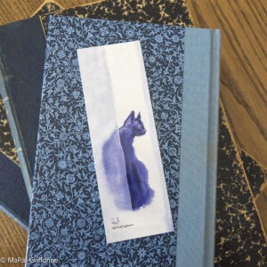Marque-page chat noir sur livre
